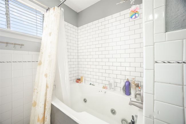 Full bathroom with a combined bath / shower with jetted tub | Image 17