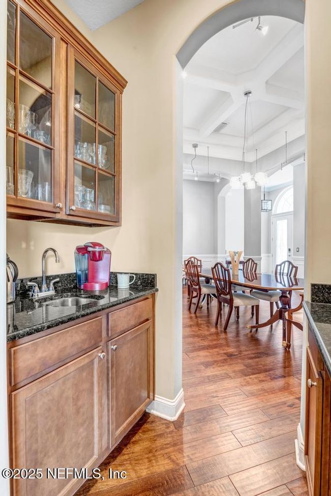 Butler's pantry w sink between kitchen and dining rooms | Image 11