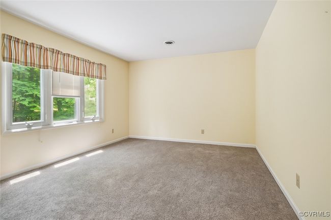 Carpeted empty room featuring baseboards | Image 19