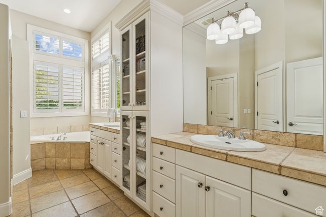 Full bathroom featuring vanity, a garden tub, tile patterned floors, and recessed lighting | Image 31