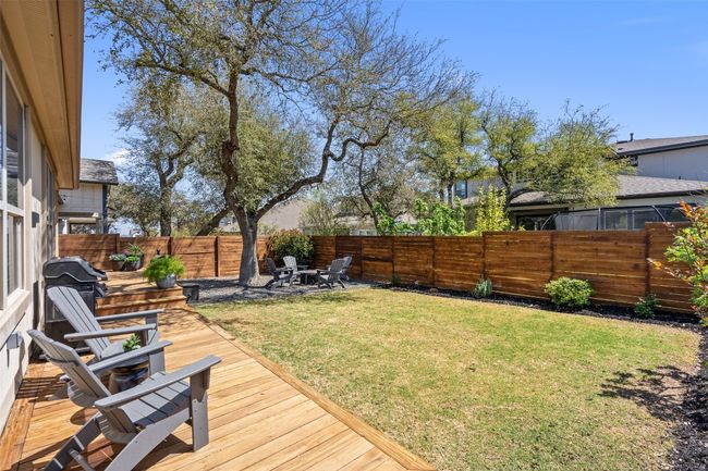 Fenced backyard featuring a wooden deck | Image 32