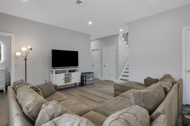 Living room with light hardwood / wood-style flooring | Image 25