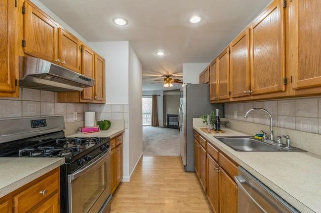 Kitchen opens to dining area | Image 9