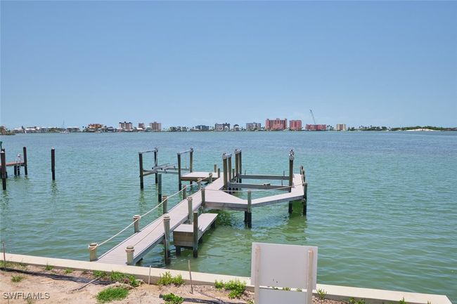 Dock area featuring a water view and a view of skyline | Image 14