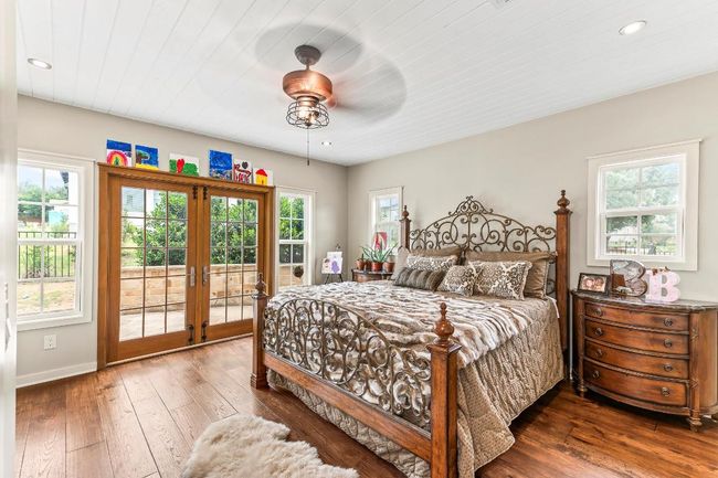 Bedroom featuring access to outside, french doors, multiple windows, and recessed lighting | Image 23