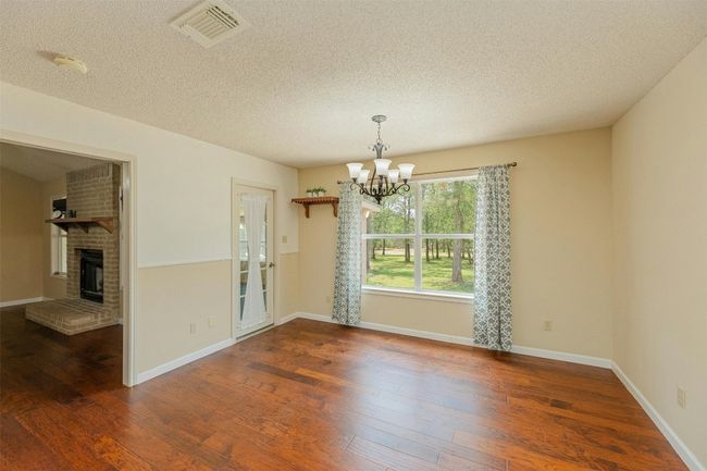 Dining area open to kitchen, overlooking the backyard. | Image 14