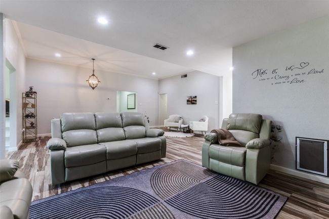 Living room with wood finished floors and recessed lighting | Image 4