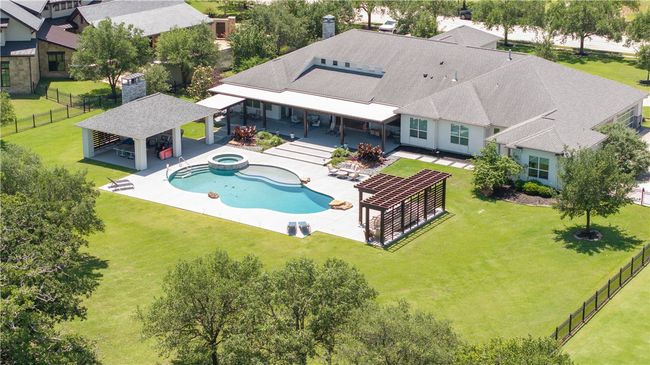 View from above of property with a pool area | Image 7