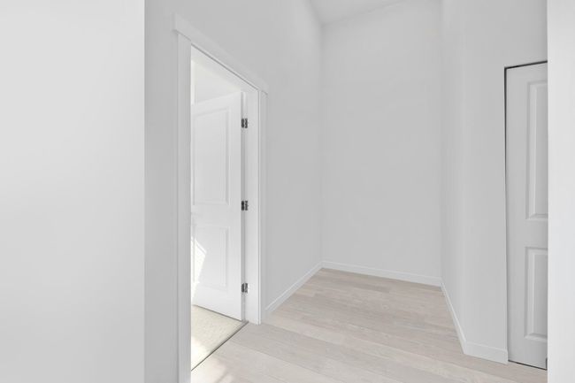 Hall with baseboards and light wood-style floors | Image 14
