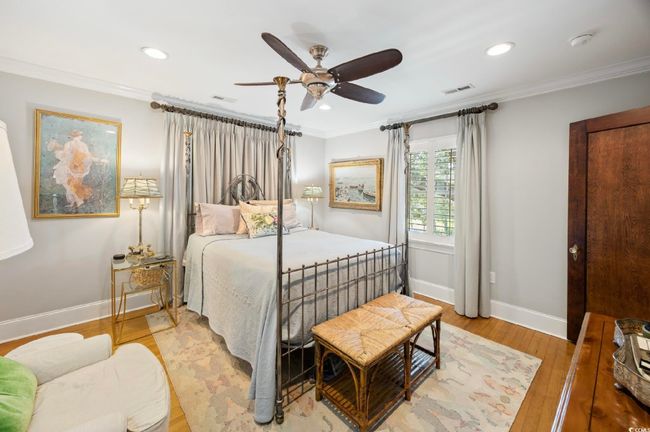 Bedroom featuring crown molding, light wood-style flooring, recessed lighting, and a ceiling fan | Image 14