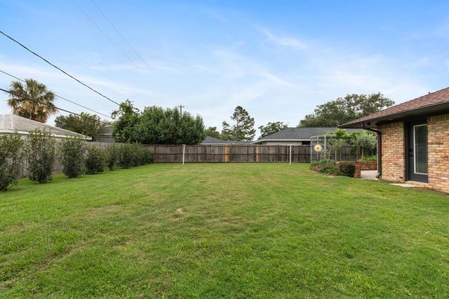 The spacious "pool-sized" back yard will be a hit with the dog. | Image 17