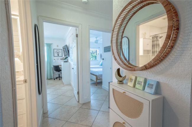 The entry features a mirrored storage cabinet to hold your keys. | Image 14