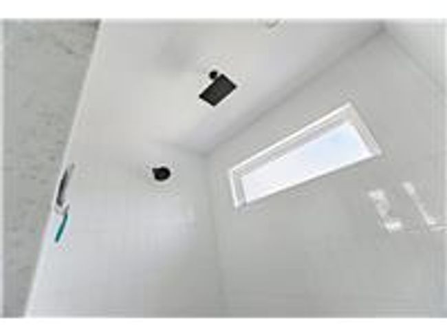 2nd floor shower interior details featuring tiled shower | Image 24