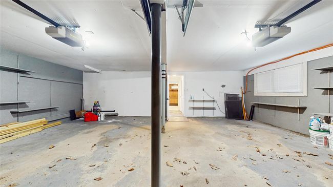 Garage featuring a garage door opener | Image 26