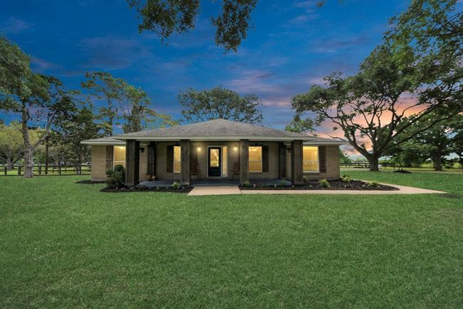 As the sun sets over 18011 Jungman Rd, the warm glow of home beckons. Peaceful, private, and perfectly placed—this is where your next chapter begins. | Image 43