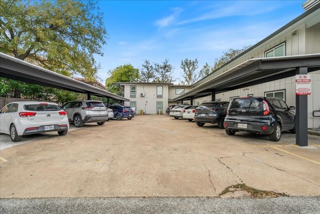 Reserved parking spaces under the detached carports. | Image 12