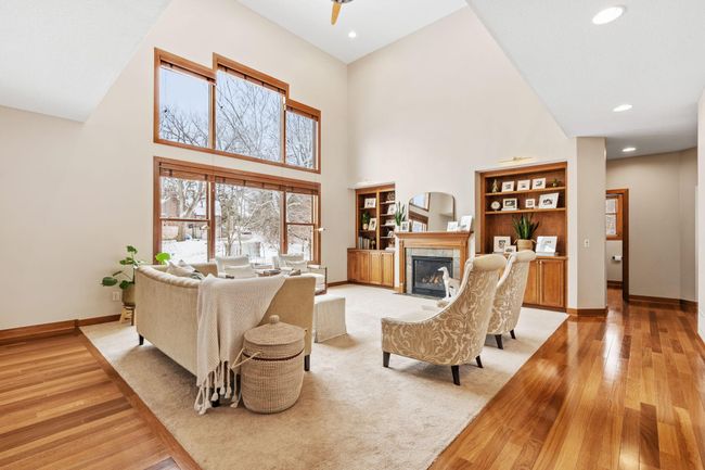 Large windows and vaulted ceilings bring this family room to life. | Image 9