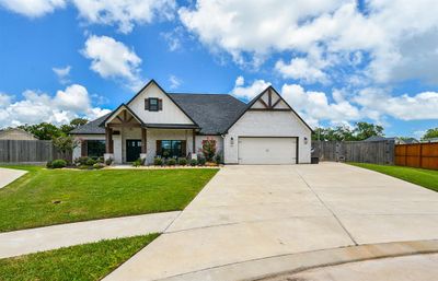 How can this beautiful home have any other address than Sundrop Court? Number 62 to be exact, in Lake Jackson, TX, in the Creekside community. Blue skies and sunshine above, green carpeting below and this impeccably maintained single family, single story brick treasure can all be yours! So, just pull right into this pristine double-wide driveway and dual vehicle oversized attached garage and make yourself at home! | Image 1