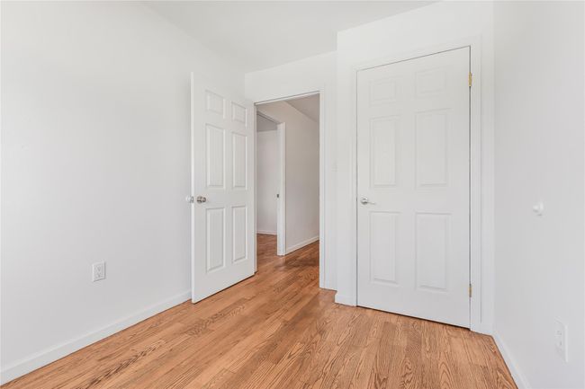 Unfurnished bedroom with light wood-type flooring | Image 16