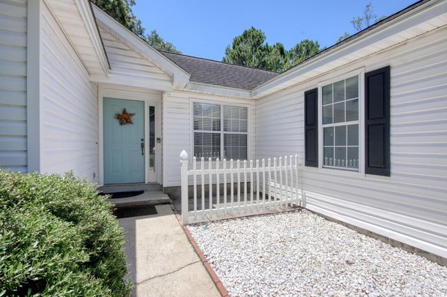 View of exterior entry with roof with shingles | Image 6
