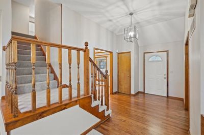 Large entry with newly refinished hardwood flooring. | Image 2