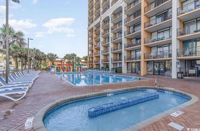 Community pool featuring a hot tub | Image 21