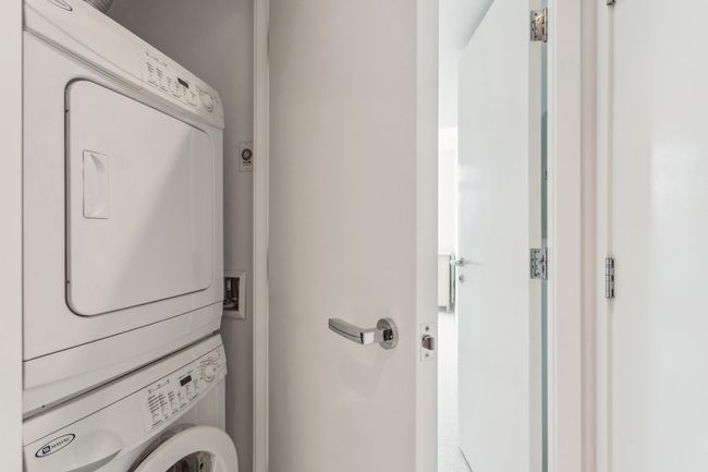 Laundry area with stacked washing maching and dryer and laundry area | Image 17