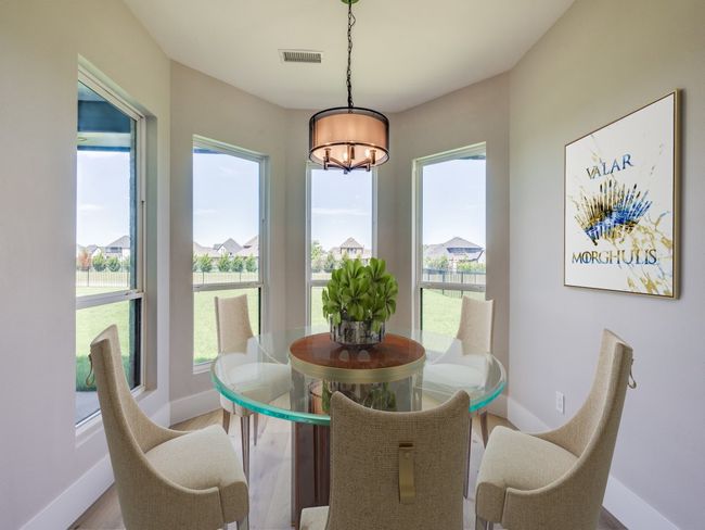 Virtual Staged Dining room with a chandelier, baseboards, healthy amount of natural light, and wood finished floors | Image 22