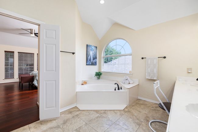 Carpeted bedroom with a closet and ceiling fan | Image 29
