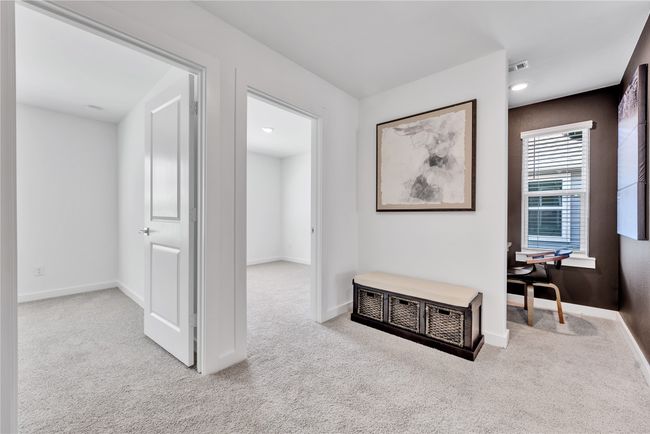 Hall with carpet, visible vents, and baseboards | Image 24