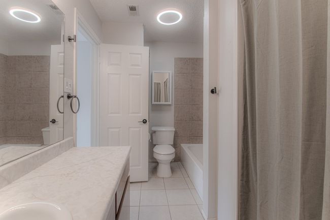 Full bathroom with tile patterned floors and vanity | Image 18