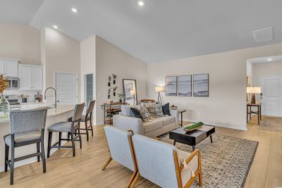 Living room with light hardwood / wood-style floors, sink, and high vaulted ceiling | Image 3