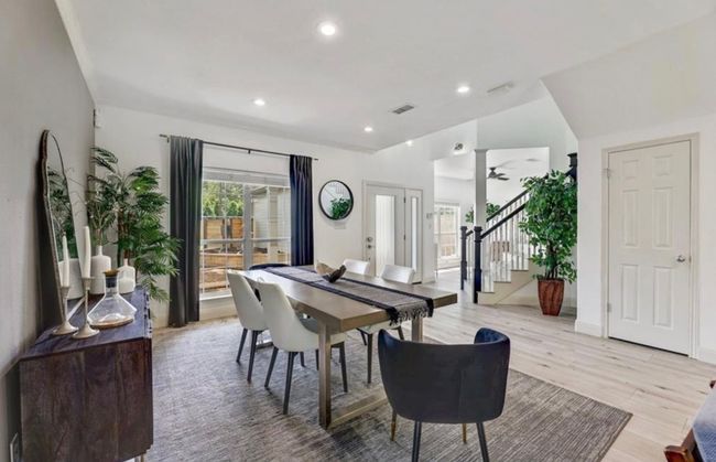 Dining room featuring visible vents, stairs, recessed lighting, a ceiling fan, and light wood-style floors | Image 25