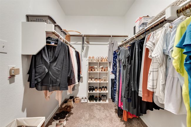 Walk in closet with carpet floors | Image 32