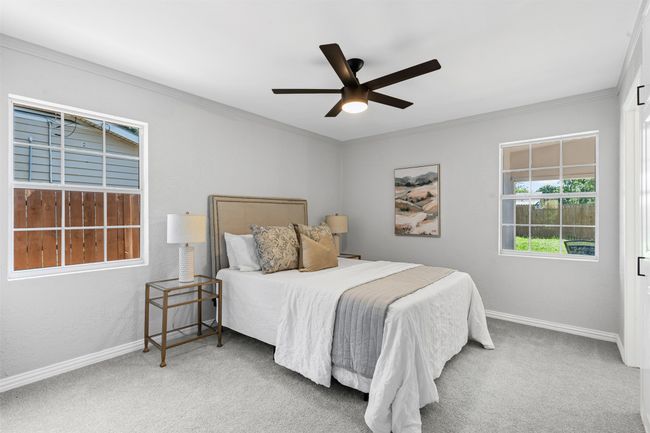 Carpeted bedroom featuring crown molding and ceiling fan | Image 19