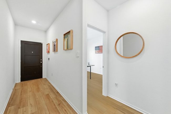 Hall featuring light wood-type flooring, baseboards, and recessed lighting | Image 21