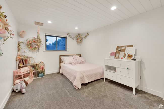 Bedroom featuring carpet floors, recessed lighting, baseboards, and wood ceiling | Image 32