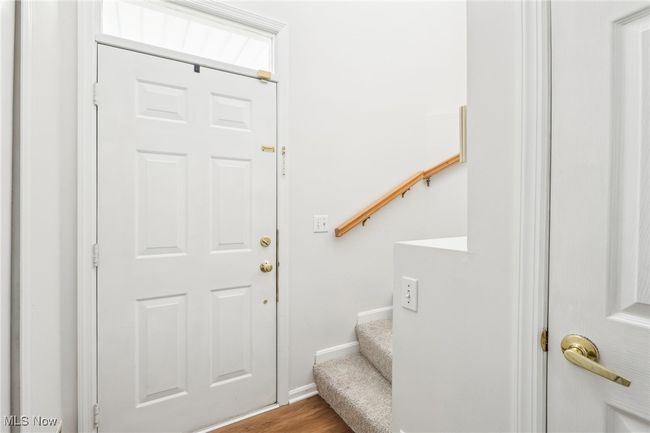 Foyer entrance with baseboards, wood finished floors, and stairs | Image 4