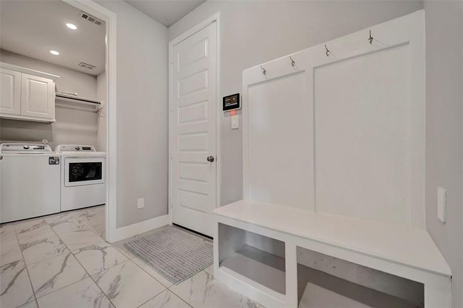 Everything stays neat and tidy with this great mudroom area. | Image 22