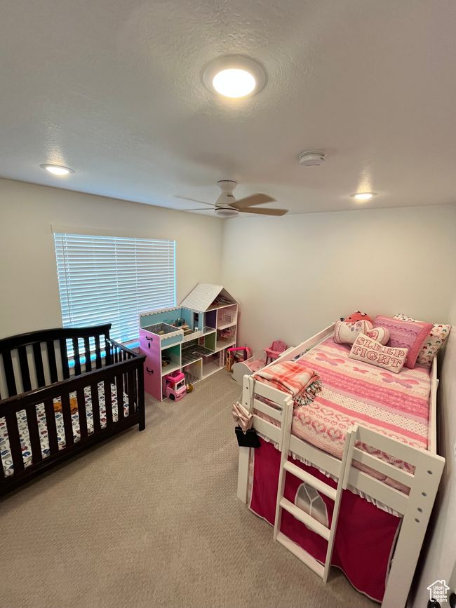 Bedroom featuring carpet flooring and ceiling fan | Image 24