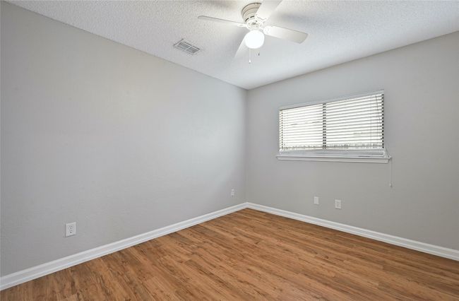 This is the other corner secondary bedroom. | Image 20