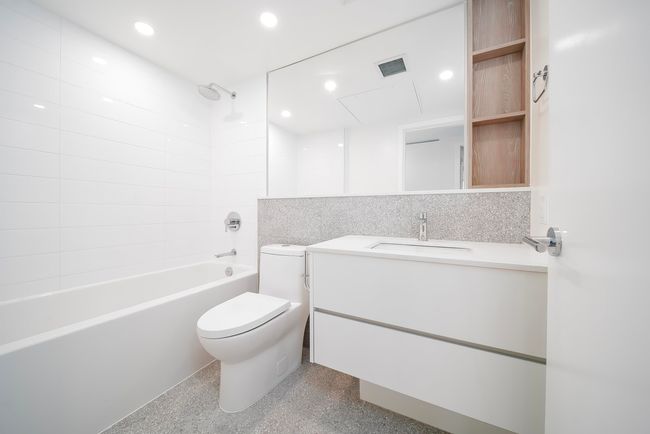 Full bathroom with toilet, recessed lighting, bathtub / shower combination, and visible vents | Image 9