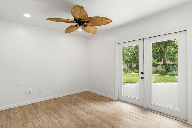 Unfurnished room featuring light wood-style flooring, french doors, a ceiling fan, and recessed lighting | Image 27