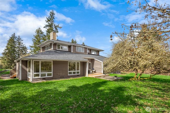 Backside of home with a large, level grassy area to enjoy! | Image 37
