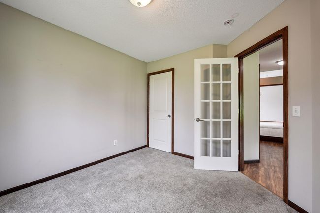 The main floor bedroom could also be used as an office | Image 10