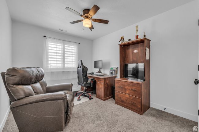 Bedroom #2, light carpet, and ceiling fan | Image 17