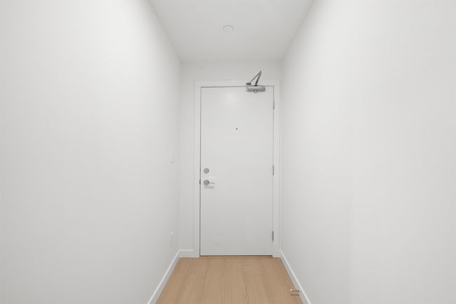 Doorway to outside with light wood-style flooring and baseboards | Image 21