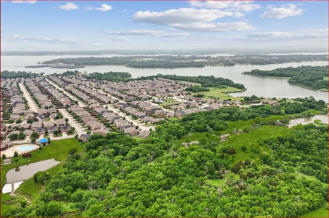 Aerial perspective of suburban area featuring a large body of water | Image 32