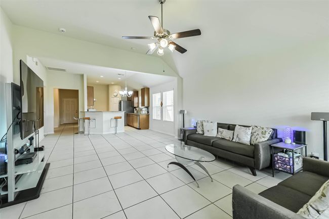 A great view from living room towards breakfast area, kitchen and hallway access to front door. | Image 16