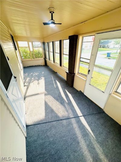 Unfurnished sunroom with ceiling fan | Image 3